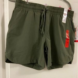 Mondetta shorts in moss green. Size medium. Never worn/new with tags